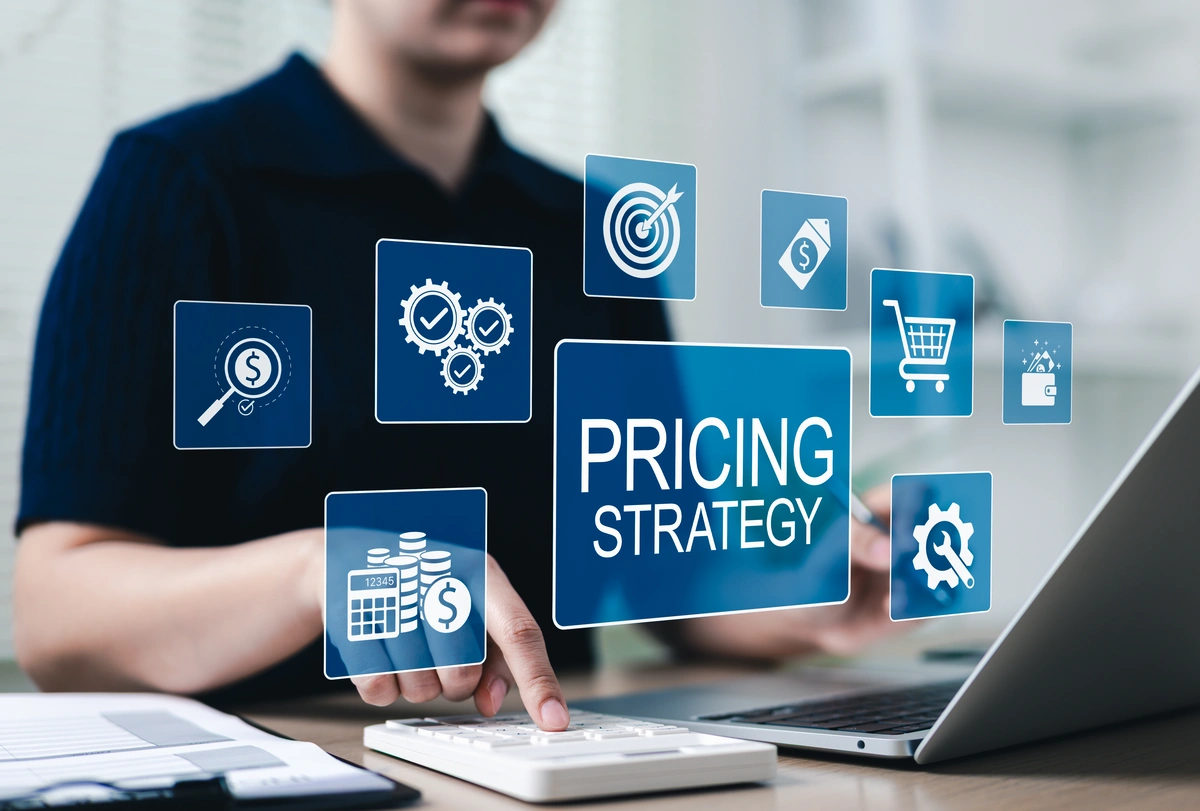 eCommerce accountant using a calculator and laptop to manage online store finances